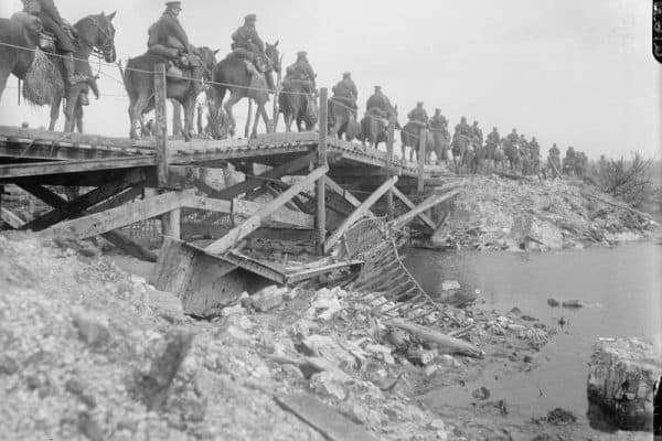 Cavalry crossing a wooden bridge over the River Somme. Copyright: © IWM. (Q 1871)