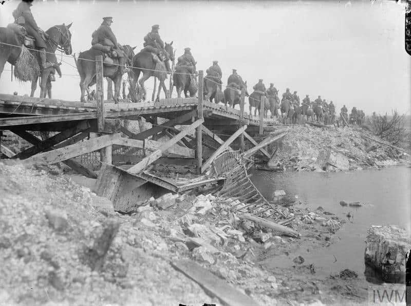 Cavalry crossing a wooden bridge over the River Somme. Copyright: © IWM. (Q 1871)
