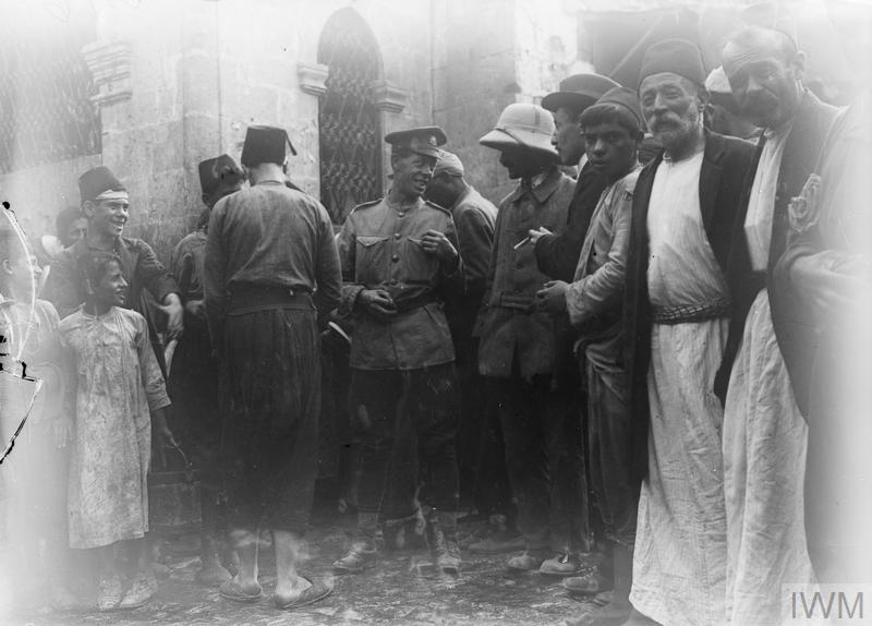 A scene in a bazaar in Aleppo including men of the 5th Cavalry Division, October 1918. © IWM (Q 12454)